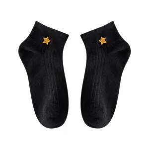 Black women ankle socks with cute yellow star embroidery, clean main view display.