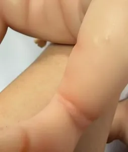 Detailed close-up of realistic skin folds on a 12 inch full silicone reborn baby doll