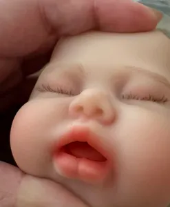 Detailed macro view showing facial features of a realistic 12 inch solid silicone reborn doll