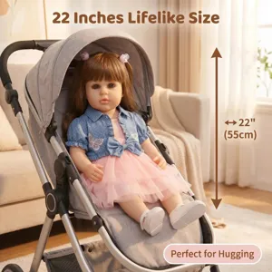 Lifelike 22-inch reborn baby doll Ellie with brown hair in denim jacket and pink dress