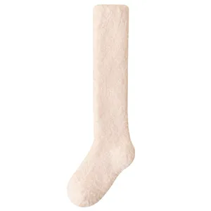 Soft light pink coral fleece knee-high plush socks for winter home wear cozy and thick