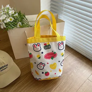 Detailed view of cute cartoon canvas tote bag featuring rabbit and heart patterns