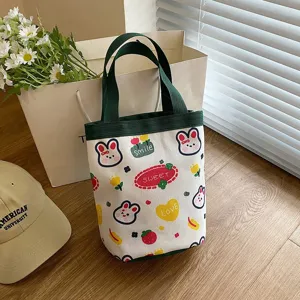 Cute cartoon canvas tote bag with rabbit prints, ideal for lunch or daily carry.