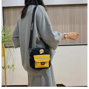 Bonito bolso bandolera de lona estilo japonés con bolsillo amarillo y pin de dibujo