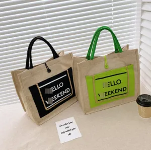 Two minimalist linen tote bags in black and green with 'Hello Weekend' print.