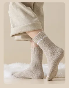 Close-up showing the thick knit texture of oatmeal wool winter socks