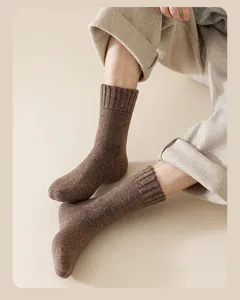 Detailed view of brown ribbed wool blend socks showing thick knit texture on feet