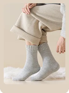 Close-up of men's thick grey wool mid-calf socks for winter warmth