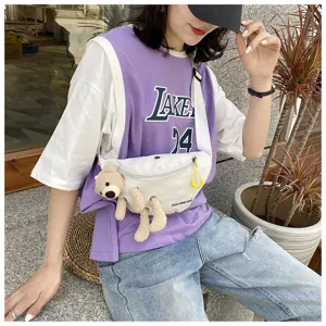 Stylish white canvas chest bag featuring a cute 3D teddy bear doll on a female model