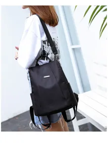 A detailed view showing the large capacity black nylon anti-theft backpack for women.