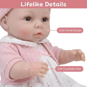Close-up of 16-inch lifelike reborn baby doll with soft skin and pink sweater.