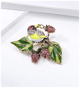 Elegant vintage magpie brooch featuring colorful enamel leaves and rhinestone berries