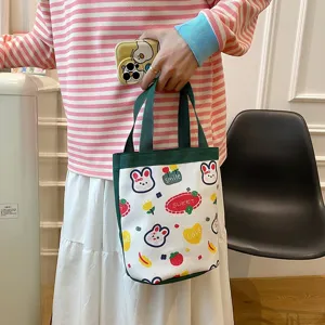 Close-up of a cute cartoon canvas handbag with rabbit patterns used as a lunch bag