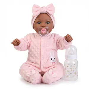 17 inch realistic reborn baby doll with dark skin in pink bunny onesie and headband