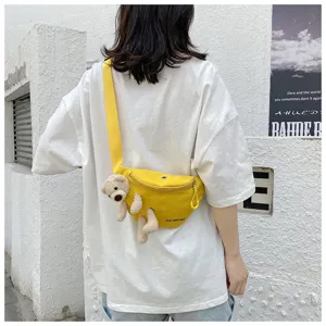 Close-up of a cute yellow canvas chest bag with a plush bear for a casual outdoor style
