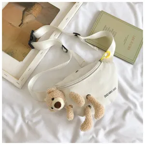 Detailed shot of the cute plush teddy bear attached to a white canvas waist bag