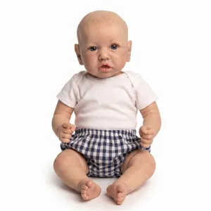 Detailed view of 22-inch realistic reborn baby doll in white tee and checkered pants