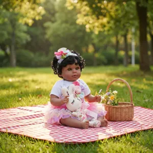 Muñeca Reborn afroamericana de 22 pulgadas con tutú sentada en una manta de picnic