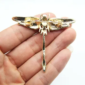 Detailed back view of vintage gold dragonfly brooch pin showing the safety clasp