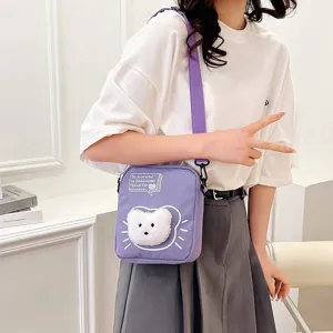 Bolso bandolera de nailon morado para niña con un lindo diseño de gato de peluche