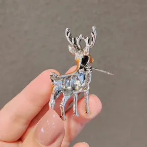 Detailed back view of an elegant silver sika deer brooch featuring yellow enamel accents