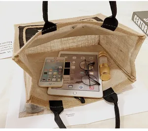 Interior view of large capacity linen tote bag showing iPad and daily essentials organized