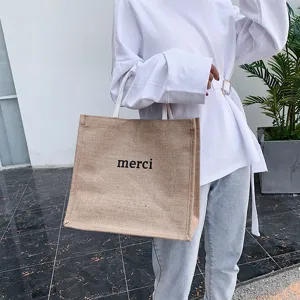 Large capacity jute tote bag with 'merci' print for casual style