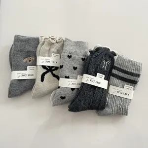 Set of 5 grey wool mid-calf socks with cute patterns, bow, heart, and embroidery details.