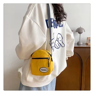 Elegante bolso bandolera amarillo ligero de nailon para móvil, estilo casual mujer