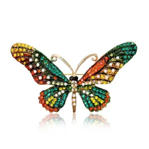 Close-up detail of a vintage butterfly brooch encrusted with vibrant multi-colored crystals