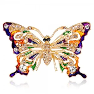 Macro detail of exquisite vintage butterfly brooch with colorful crystals and enamel finish