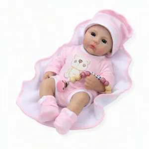 Macro detail view of 16-inch solid platinum silicone reborn doll wearing pink bear onesie