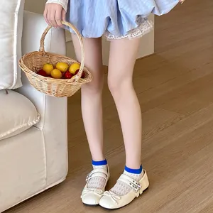 Detail shot of breathable hollow-out cute short socks paired with stylish shoes in a sweet setup.