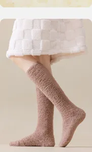 Close-up view of warm coral fleece mid-calf socks for women in soft brown winter style
