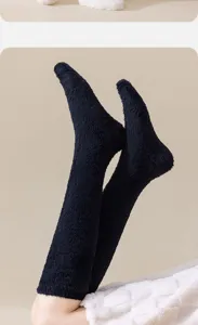 Detailed view of navy blue coral fleece warm knee-high socks with fluffy texture