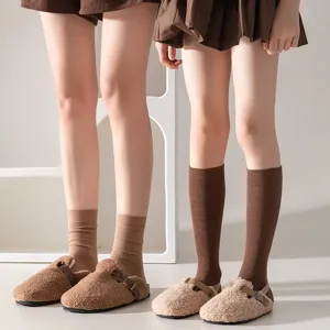 Comfortable ribbed mid-tube cotton socks in brown, paired with cozy winter furry casual shoes.