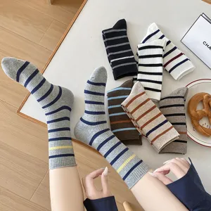 Close-up detail of stylish multi-color striped crew socks for women with knit texture