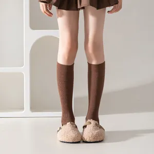 Brown ribbed mid-tube women socks, cozy cotton stretch winter knit socks detail view.