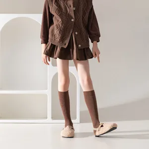 Detail view of brown vertical stripe mid-calf cotton socks, cozy fall winter wear style.