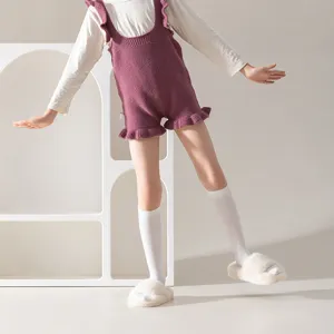 Comfortable kids knitted rompers with white mid-tube socks, autumn and winter daily wear style.