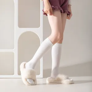 Comfortable ribbed mid-calf cotton socks for women, soft texture, classic white design.