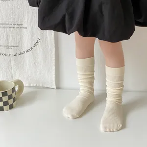 Cozy cream ribbed mid-calf socks detail shot, soft cotton texture, cute everyday wear.