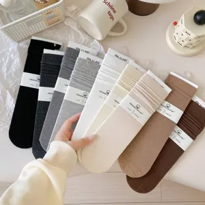 Detailed view of ribbed mid-tube socks in assorted colors, soft cotton texture for autumn.