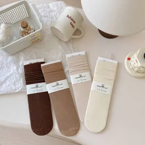 Detail view of Korean style ribbed cotton mid-calf socks in earthy brown and beige colors.