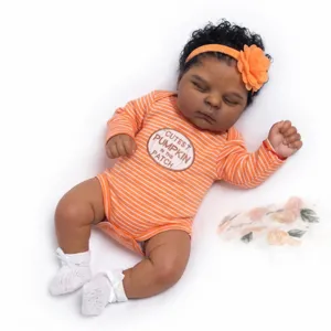 Detailed view of a 19-inch reborn baby doll in an orange striped pumpkin onesie