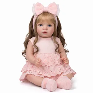 Realistic 22 inch reborn baby doll Missy in a pink lace dress with a bow headband