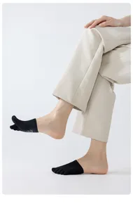 Detailed view of black half-toe five-finger socks showcasing breathable mesh fabric and fit.