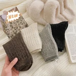 Warm women's winter wool socks with colorful flecks and vertical stripes in four colors