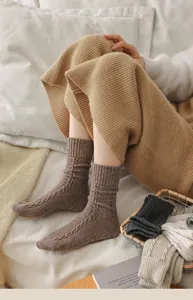 Cozy brown cable knit wool socks detail shot, soft warm winter slouch socks for women daily wear.