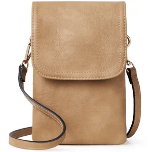 Detailed view of minimalist tan PU leather crossbody phone bag with polished gold hardware